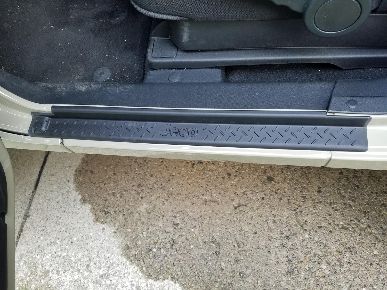 Mopar 82210104AB Door Sill Entry Guards in Black Plastic with Jeep Logo