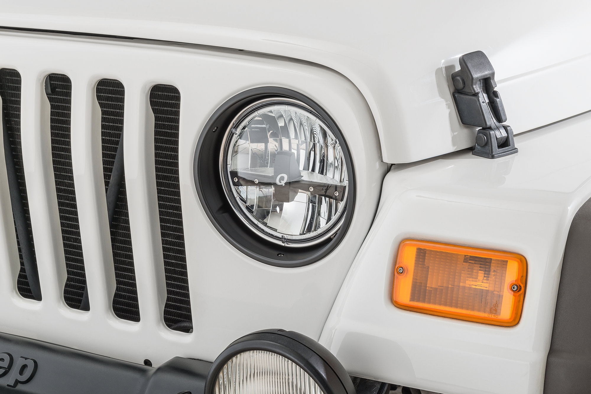 Rugged Ridge  Headlamp Bezels in Black for 97-06 Jeep Wrangler TJ &  Unlimited | Quadratec