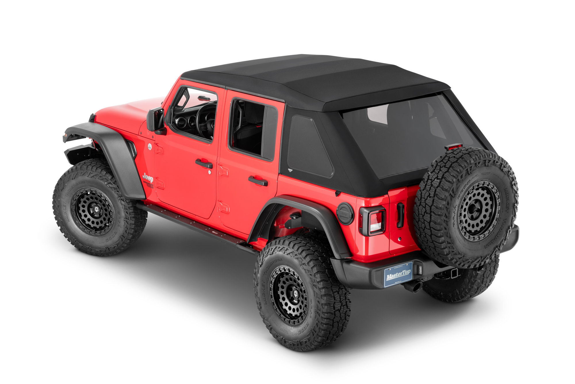 Red Jeep Wrangler with a black soft top against a white background