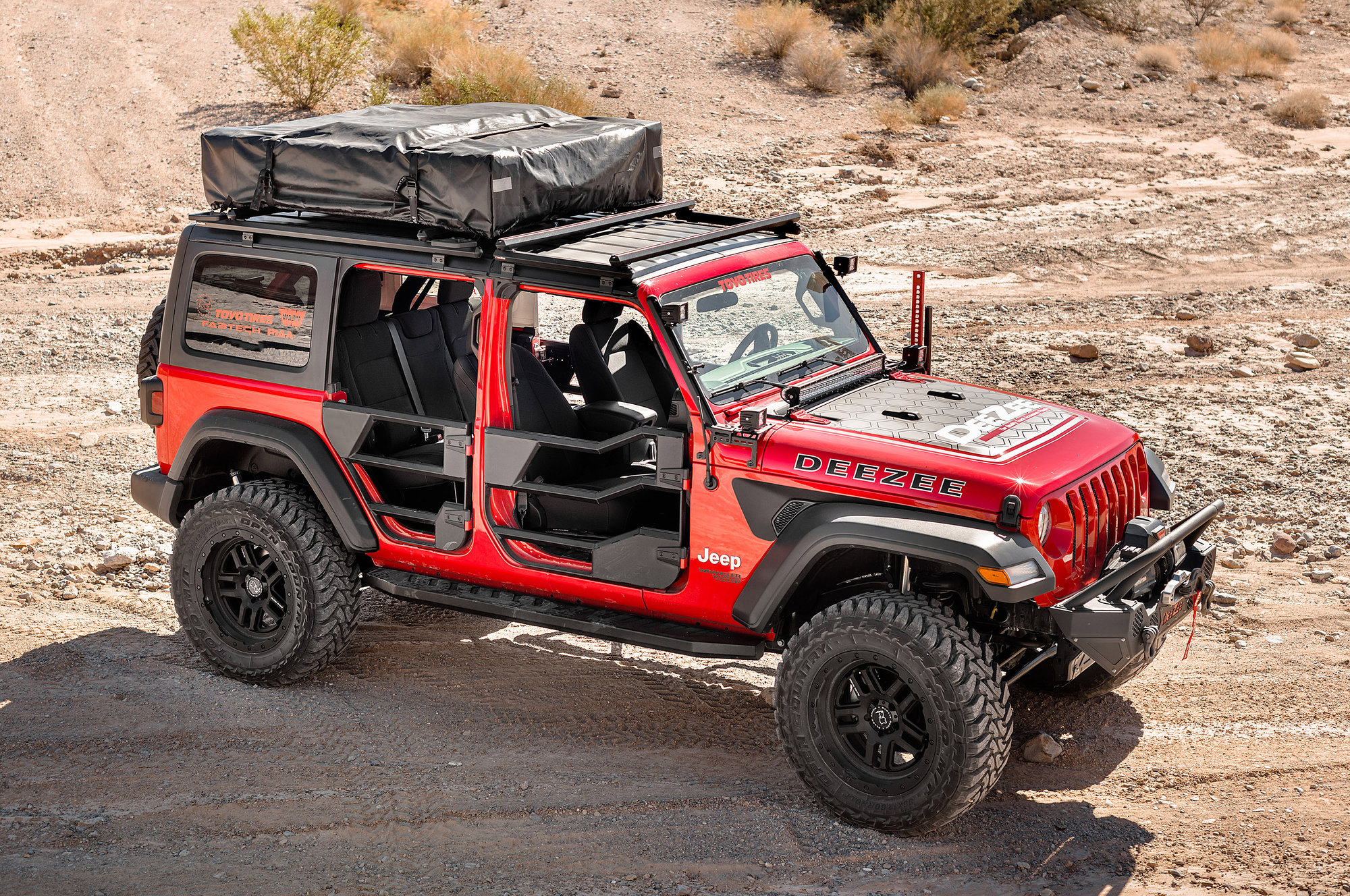 https://www.quadratec.com/sites/default/files/styles/product_zoomed/public/product_images/DeeZee-Jeep-RoofRack-JK-JL-DZ4472JL-Lifestyle1_0.jpg