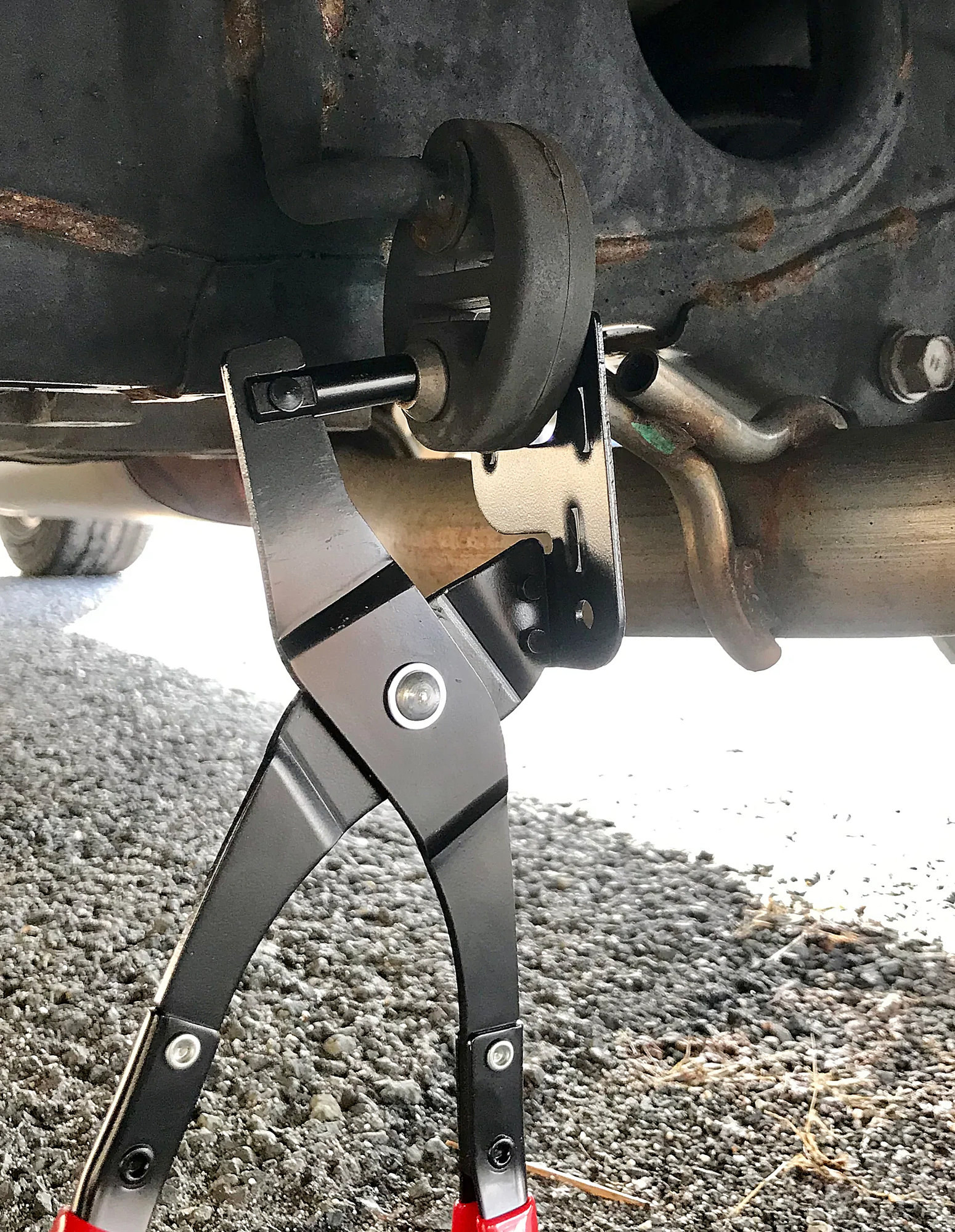 How to: Disconnect exhaust hangers with pliers & lower exhaust 