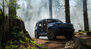 Blue Jeep Recon in a forest setting on a trail 