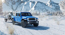 Blue Jeep Gladiator with a snowy background