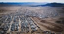 Vehicles and tents in the California desert
