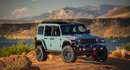 Light blue Wrangler Rubicon with a desert background