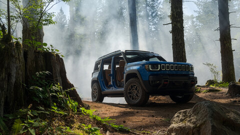Blue Jeep Recon in a forest setting on a trail 