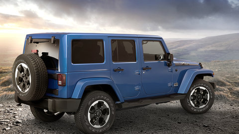 Blue Jeep against mountain background