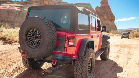 Red Jeep with desert background