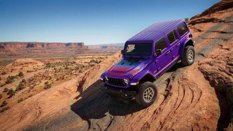 Purple Jeep with a desert background