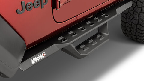 Black side steps on a red Jeep Wrangler 