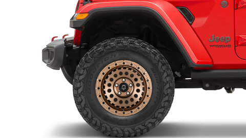 Red Jeep Wrangler with bronze Jeep wheels 