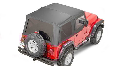 Red Jeep Wrangler YJ with a black soft top.
