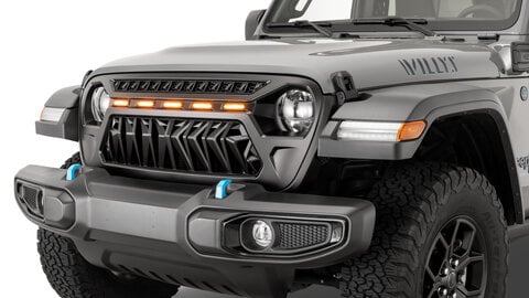 A Jeep Wrangler Willys shows off its TACTIK Goblin Grille with integrated amber accent lighting for a bold, custom front-end look.