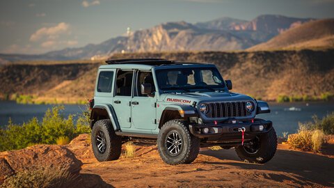 Light blue Wrangler Rubicon with a desert background